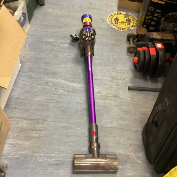Purple Dyson cordless vacuum cleaner for home cleaning.