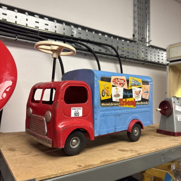 Vintage Tri-ang ride-on truck, a classic children’s toy.
