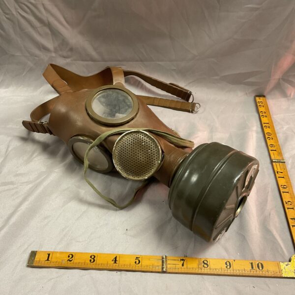 Vintage Cold War CBB M51 gas mask with circular viewing window.