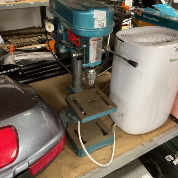 Vintage Naerok pillar drill in a workshop setting.