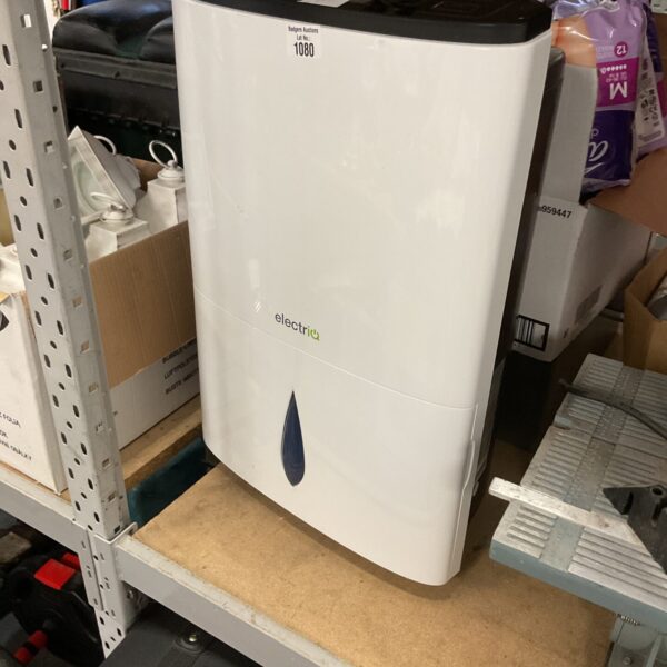 Used Electria dehumidifier for moisture removal in a home setting.