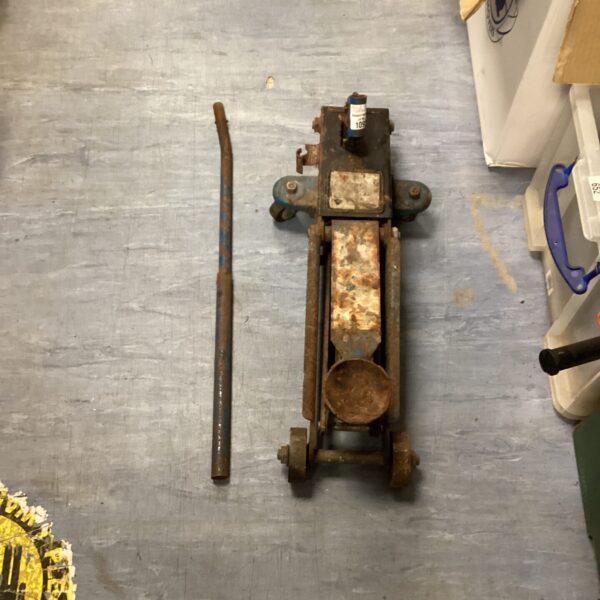 Vintage trolley jack for automotive repair and restoration.