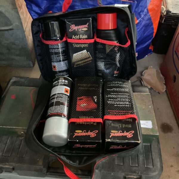 Supaguard car spray kit with various spray cans.