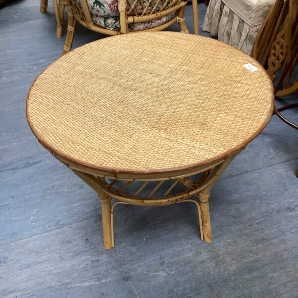 Vintage circular bamboo table with woven top.