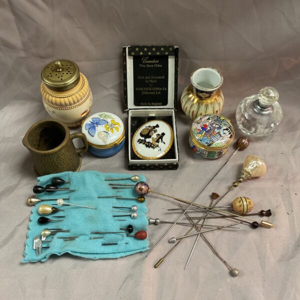 Vintage hatpins and enamel pots in a mixed lot.