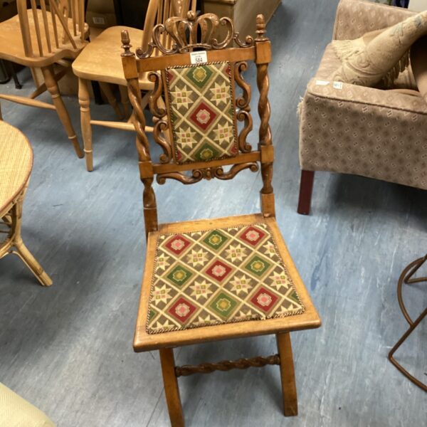 Antique Victorian walnut folding chair with fabric seat.
