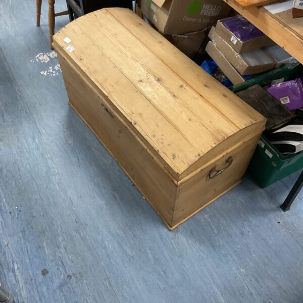 Large wooden chest with a rustic, weathered appearance.