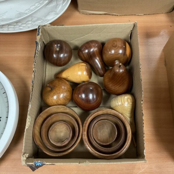 Close-up of a collection of carved wooden fruit pieces.