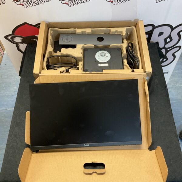 Dell monitor in original box with stand and cables.