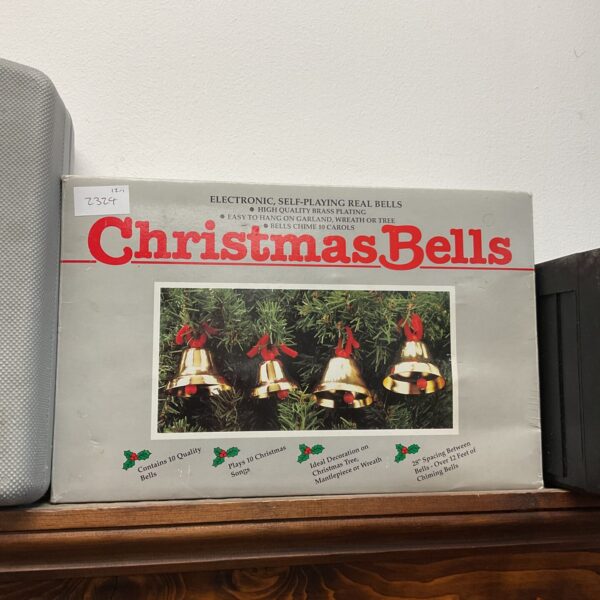 Brass electronic self-playing Christmas bells for holiday decor.