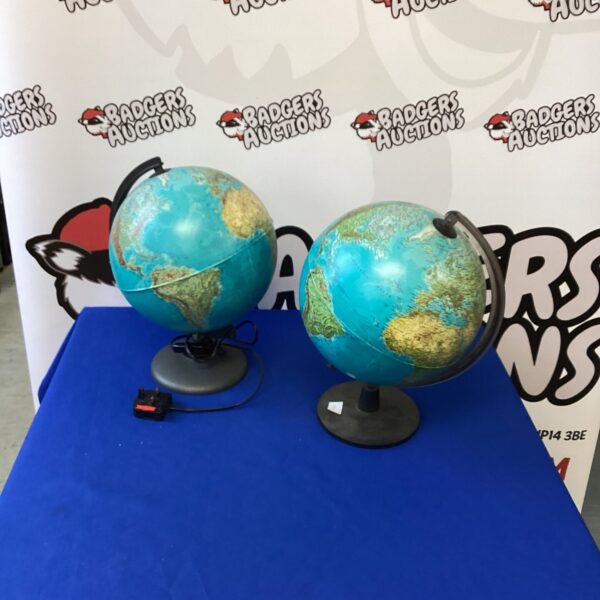 Vintage illuminated globe on black base, geographical map.
