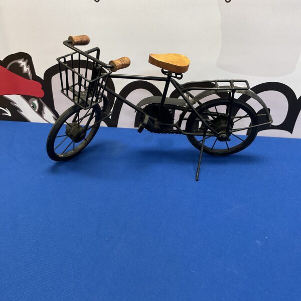 Vintage metal model bicycle with wooden seat and handlebars.