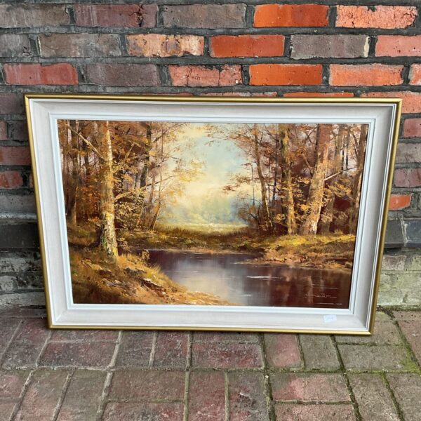 Signed autumnal river oil painting depicting a woodland landscape.