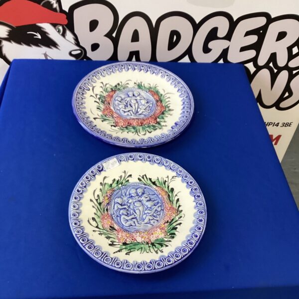 Vintage Italian Majolica plate with cherub design.