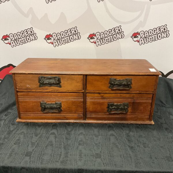 Vintage wooden desktop drawers for office storage.