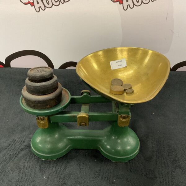 Vintage cast iron scales with weights for kitchen use.