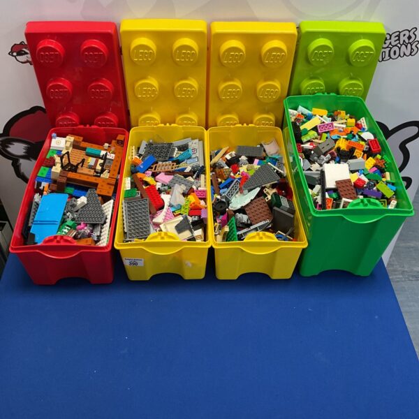 Four boxes filled with mixed Lego bricks and building blocks.