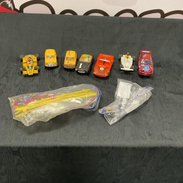 Vintage Scalextric cars in a mixed lot, collectible racing toys.