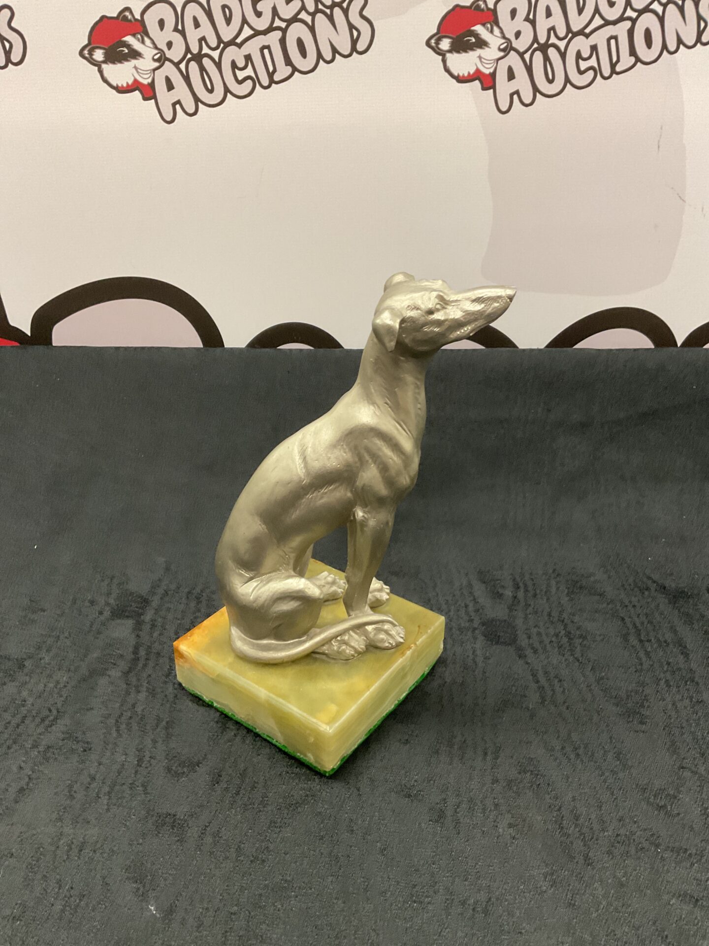 043 silvered composite greyhound on onyx stand