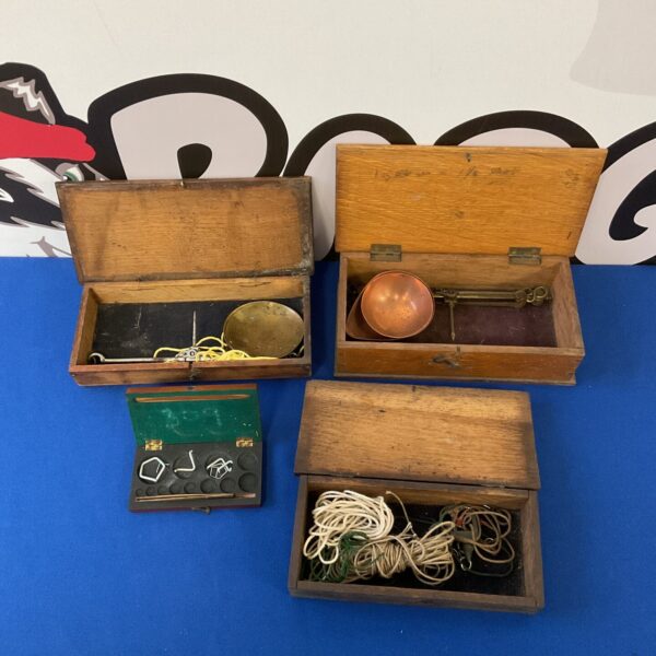 Antique apothecary balance scales set in wooden box.