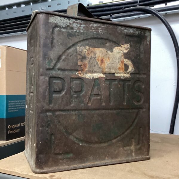 Vintage Pratts petrol can with weathered paint and iconic branding.