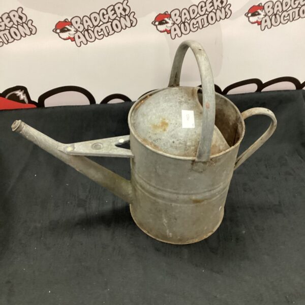Vintage galvanised watering can for garden use.