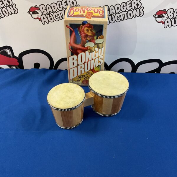 Vintage House of Marbles bongo drums, a classic percussion instrument.