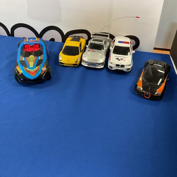 Selection of remote control cars including Bugatti and Lamborghini models.