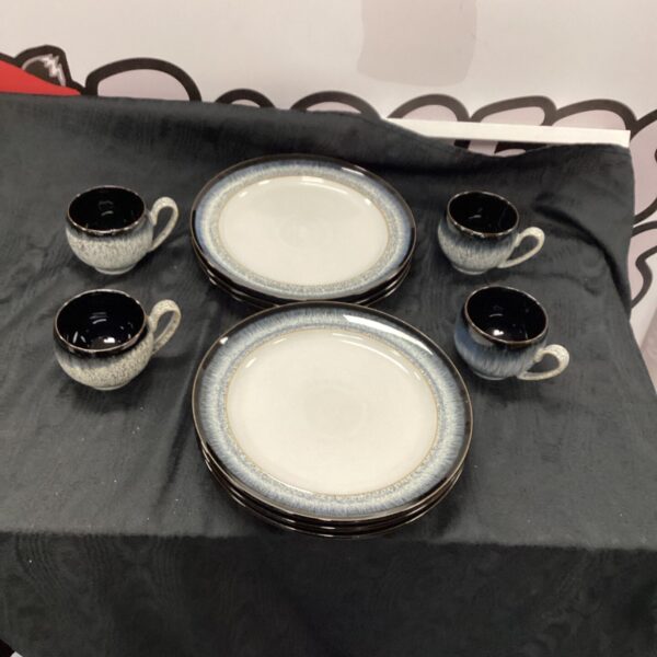 Selection of Denby stoneware plates and mugs in blue-grey glaze.