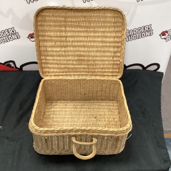 Vintage wicker basket with open top, ideal for storage.
