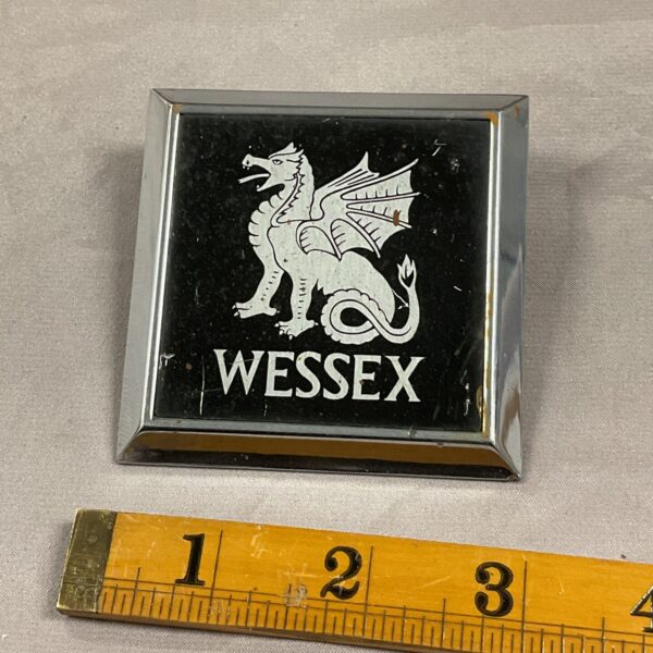 Vintage Wessex grill badge with rampant lion design.
