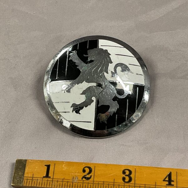 Vintage Scottish car grill badge with lion rampant emblem.
