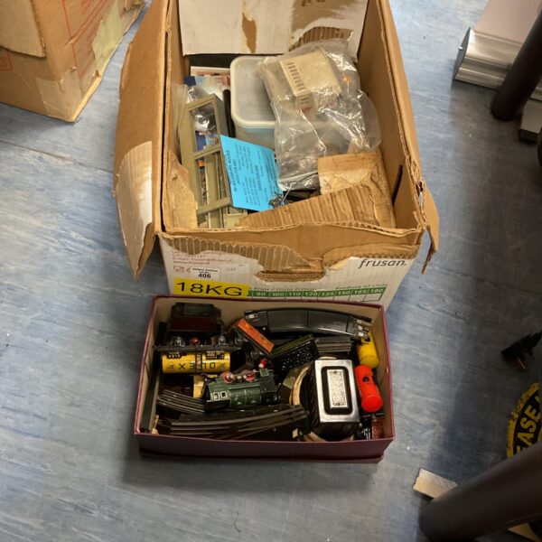 Vintage Trix Express trains and railway accessories in two boxes.