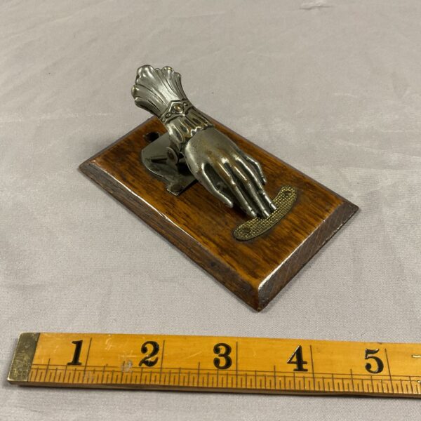 Antique Victorian hand letter clip on wooden base.