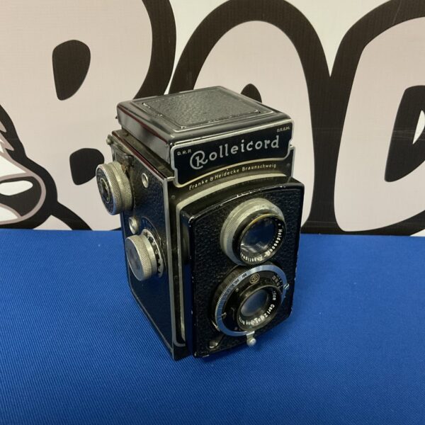 Vintage Rolleicord Compur camera, front view, classic German film camera.