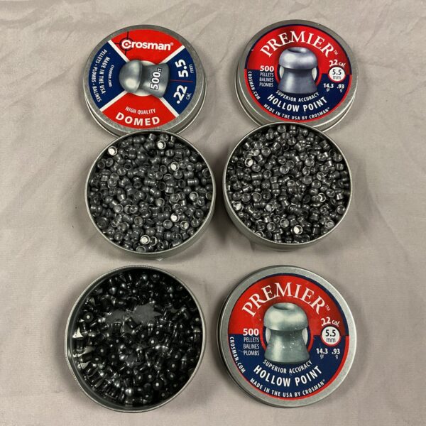 Close-up of a lot of Crossman .22 caliber air rifle pellets in tins.