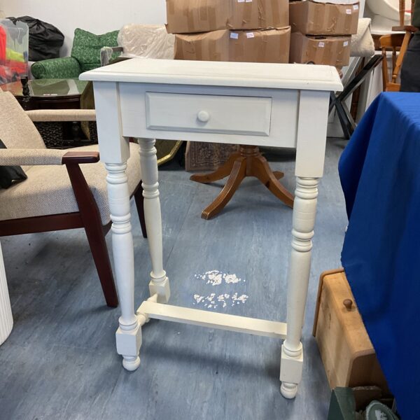White shabby chic console table with drawer and turned legs.