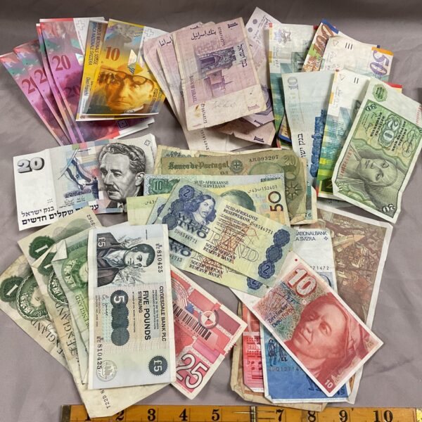 Diverse collection of assorted bank notes from various countries.