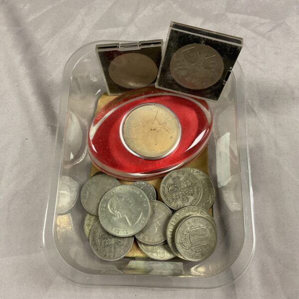 Tray of assorted vintage and collectible coins for numismatics.