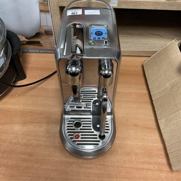 Sleek silver Sage Nespresso Creatista coffee machine for home use.