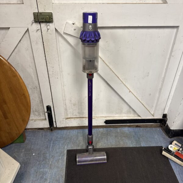 Purple Dyson V10 Absolute cordless vacuum cleaner in used condition.