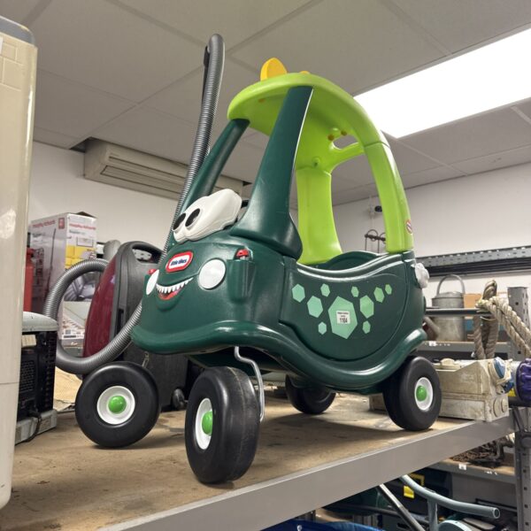 Green and lime Little Tikes ride-on buggy, side view.