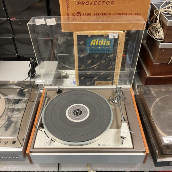 Vintage Leak Delta turntable with wooden plinth.