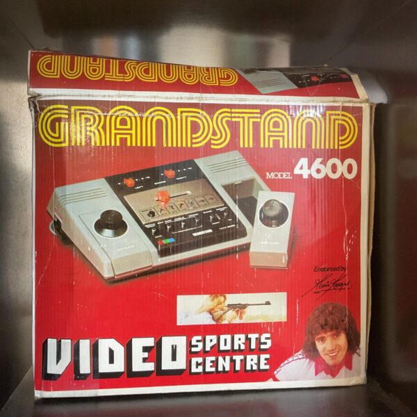 Vintage Grandstand model 4600 handheld games console, grey plastic casing.
