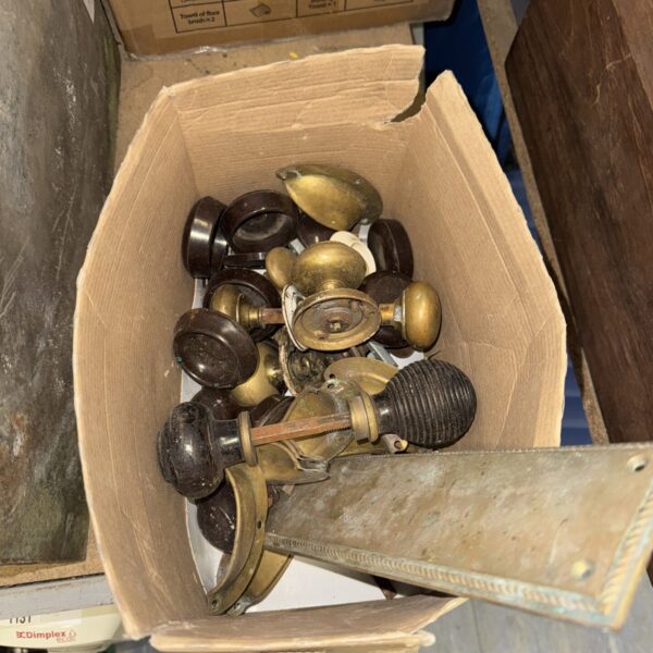 Vintage brass door furniture lot with knobs and handles.