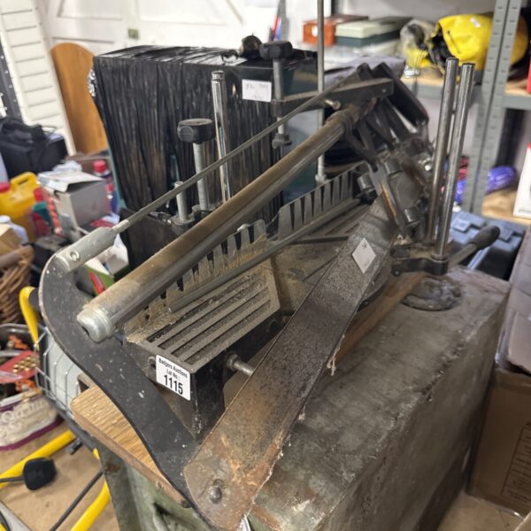 Vintage Draper mitre saw in a workshop setting.