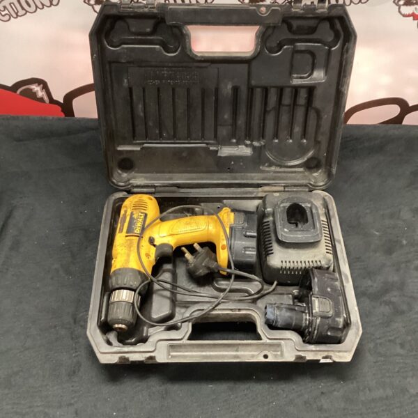 DeWalt DC970 cordless drill with charger in open case.