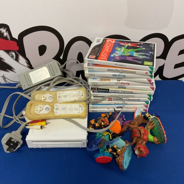 Nintendo Wii console with included games and cables for retro gaming fun.