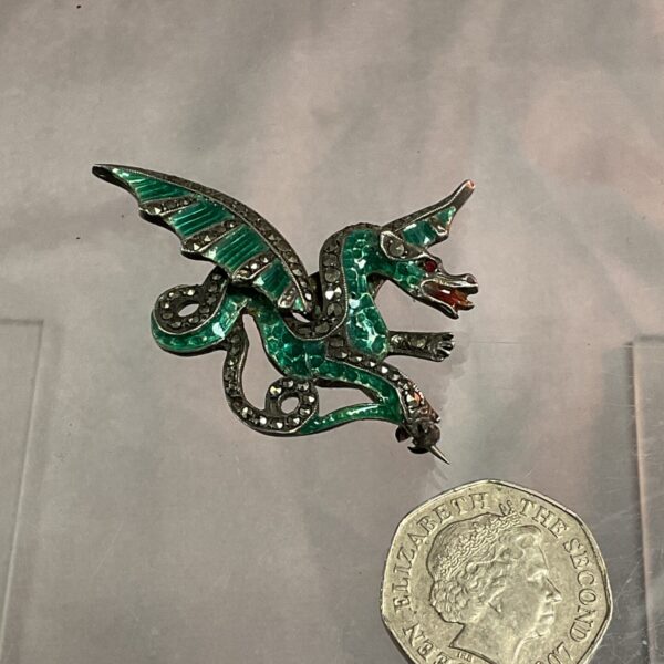Vintage silver brooch with green enamel dragon and marcasite stones.