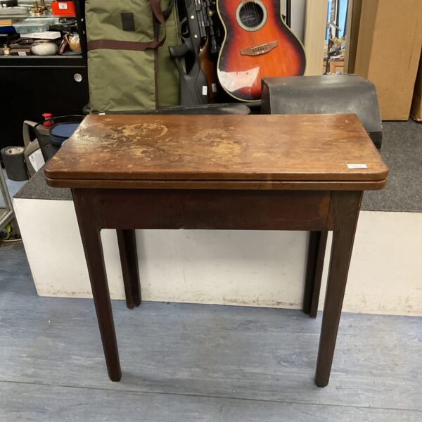 Antique oak gate leg table with a square top and dark finish.